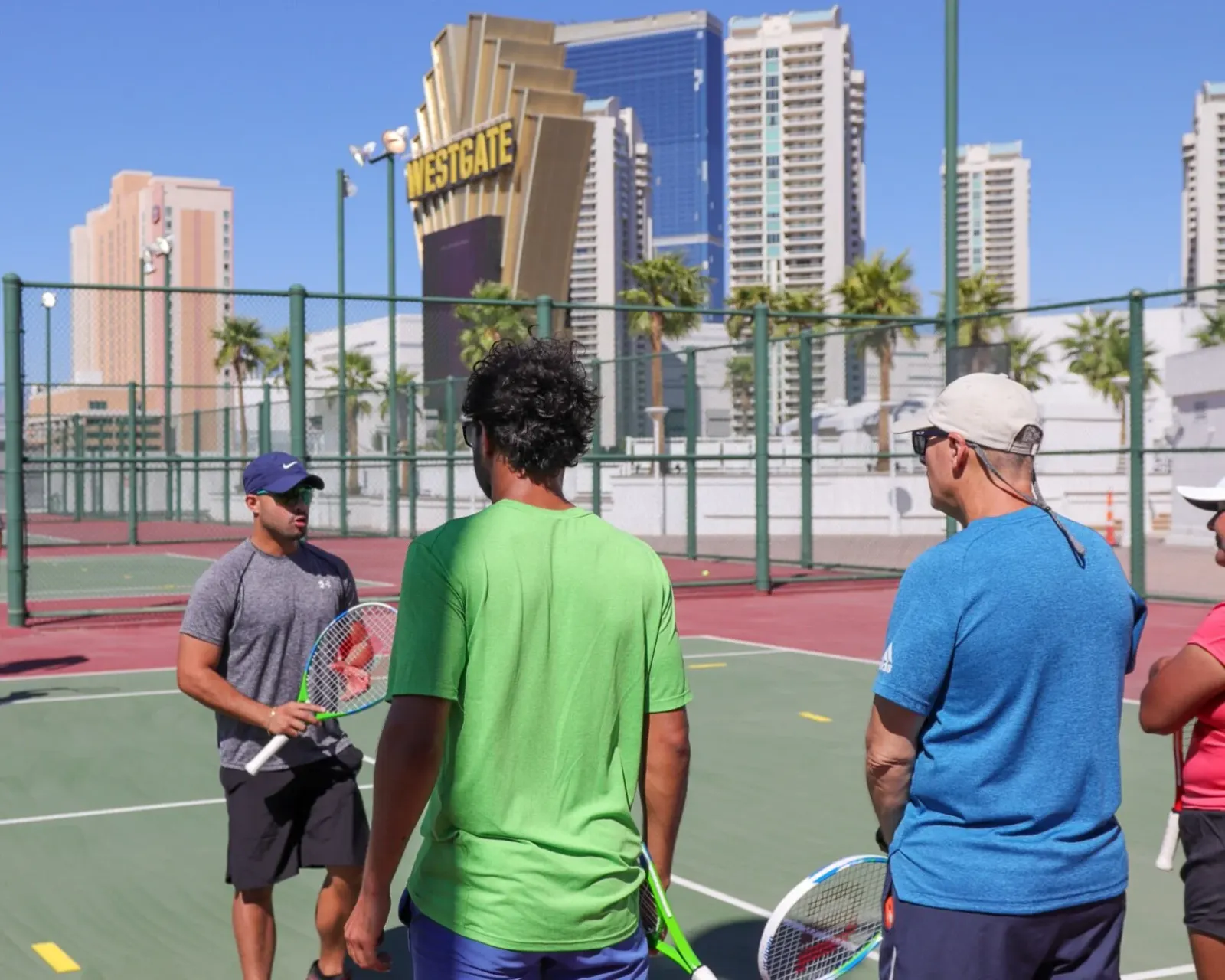 Coach with players on court, Miami skyline
